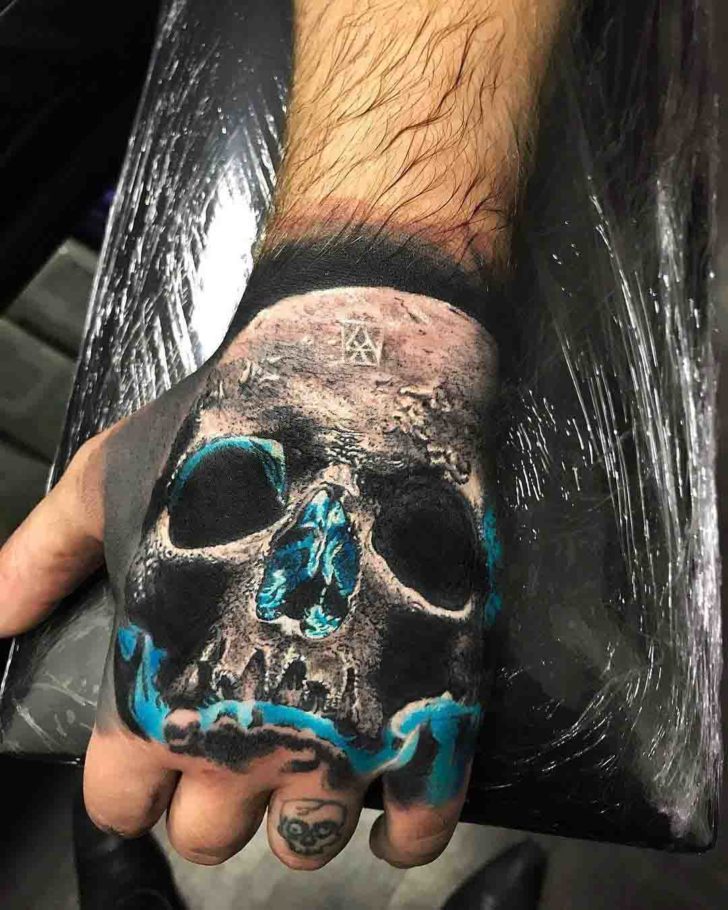 Blue Glow Skull Tattoo on Hand | Best Tattoo Ideas Gallery