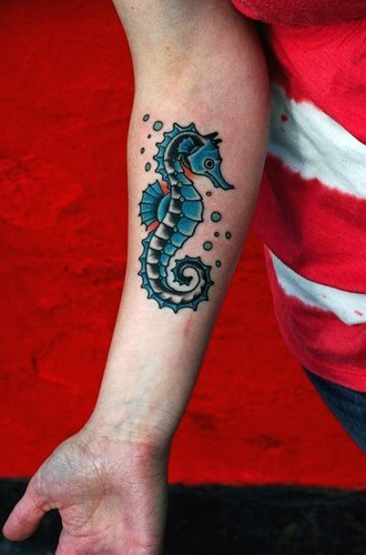 Blue Sea Horse tattoo on arm