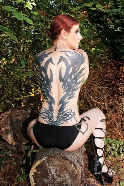 The whole back girl tribal tattoo
