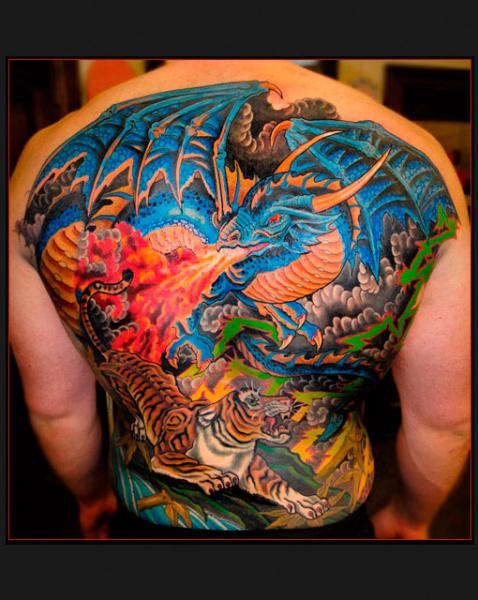 Tiger and Dragon Fight tattoo by Chapel tattoo - Best Tattoo Ideas Gallery