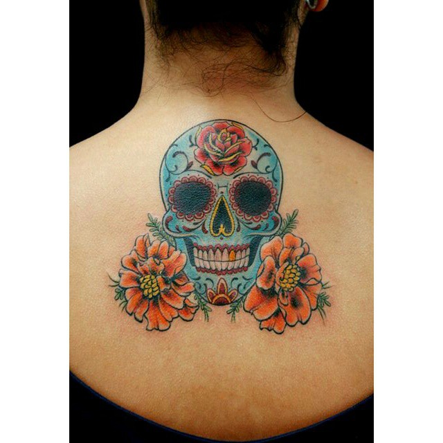 Smiling Chicano Skull tattoo on Back