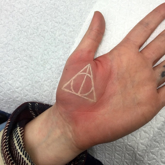 Circle in Triangle Palm tattoo