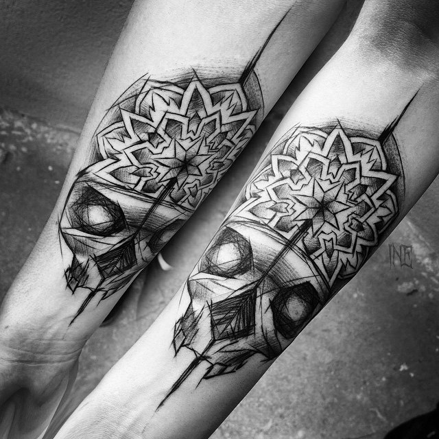 Matching Skull Tattoos on Arms