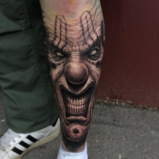 Wrinkled Evil Clown Tattoo on Shin