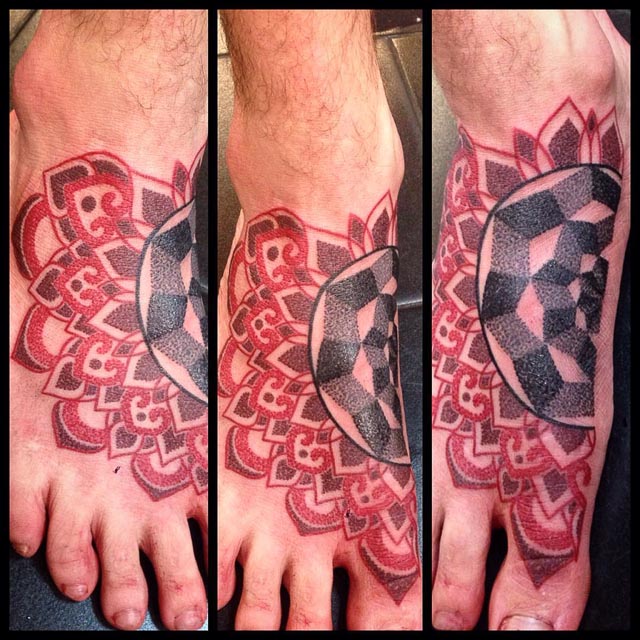 black and red dotwork tattoo on foot