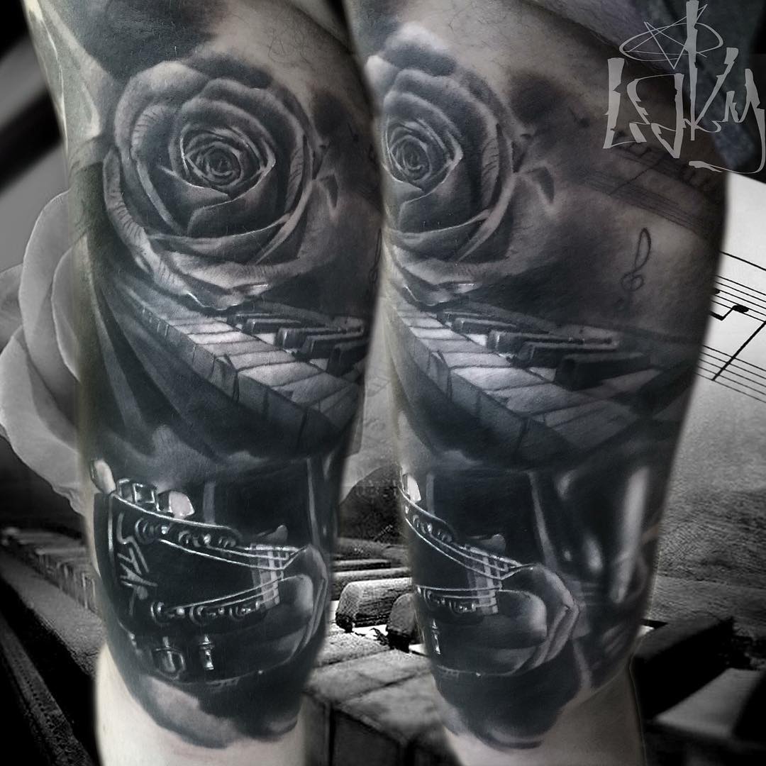 black and grey musical tattoo of musical instruments