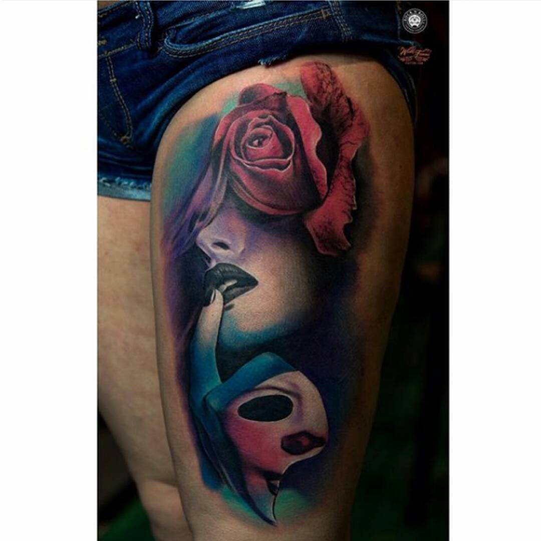 very passionate tattoo on the girl's thigh