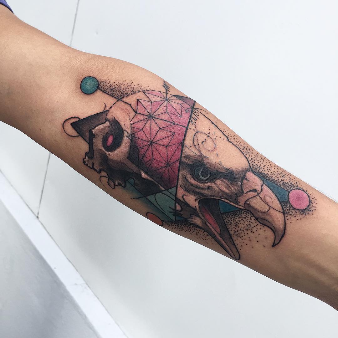 skull and eagle tattoo on arm