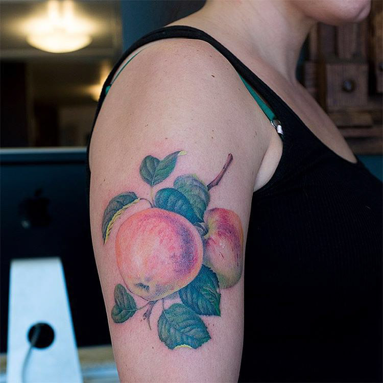 realistic tattoo apple on shoulder