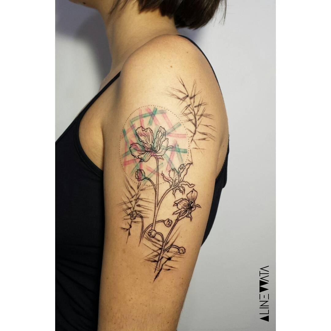 shoulder decorated with a tattoo of a rare for the art venus flytrap flower