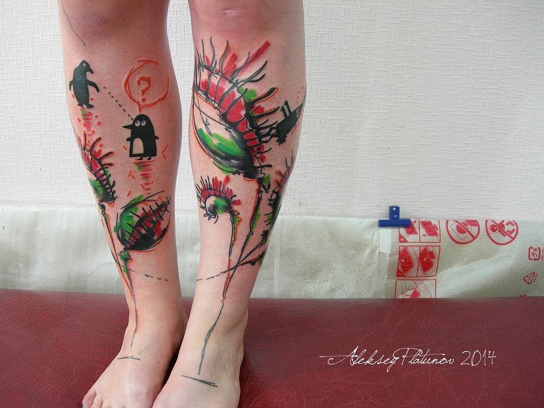 both legs decorated with flytrap flowers tattoos