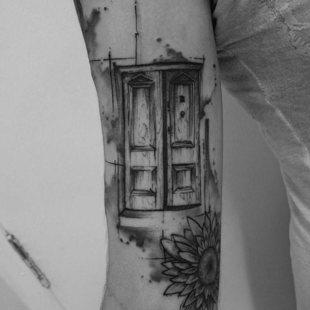 arm tattoo of a door