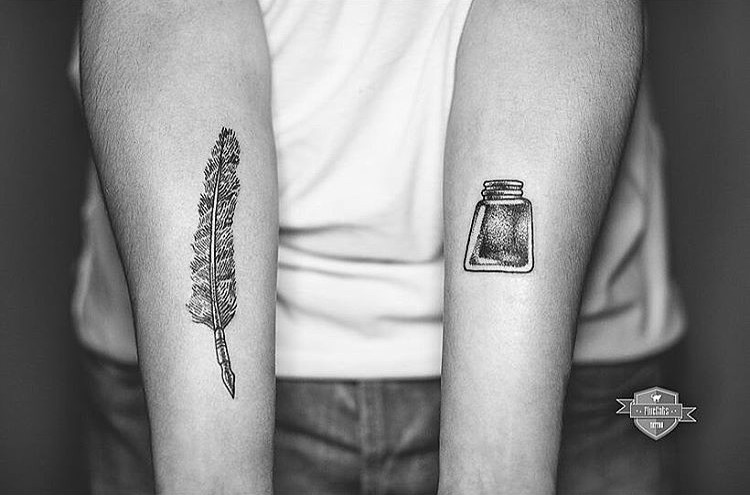 Forearms decorated with Feather and Inkstand Tattoos