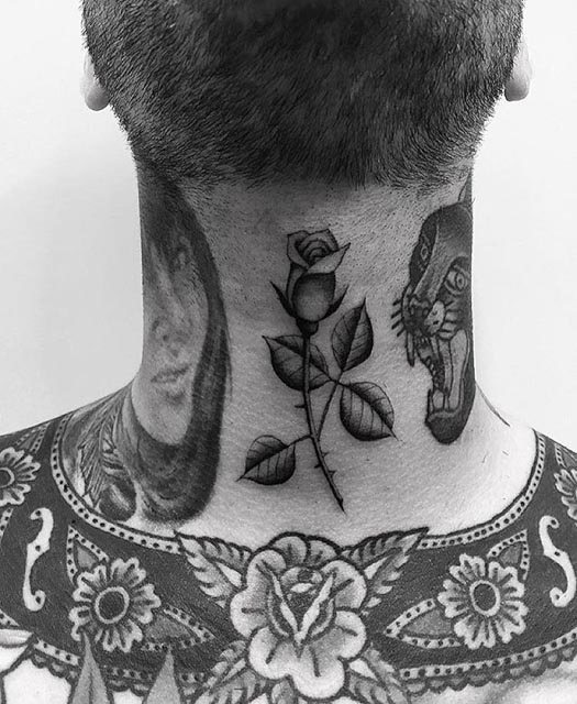 small rose tattoo on neck