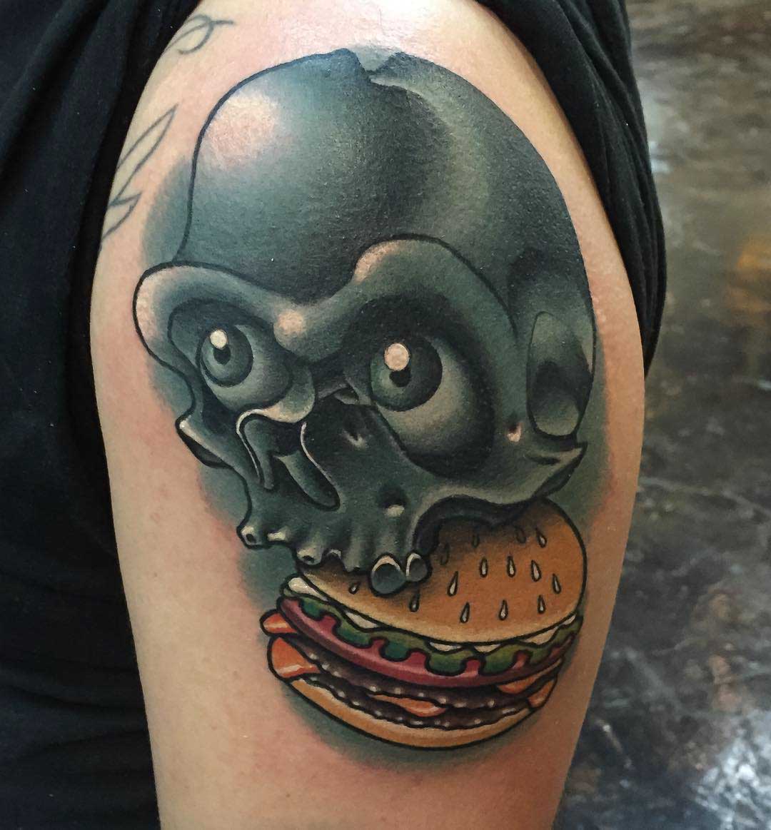 shoulder tattoo of skull and burger, new school style