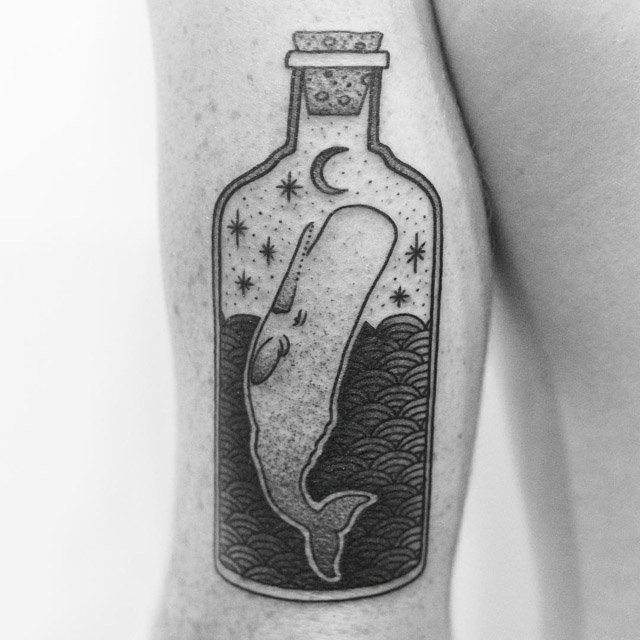 arm tattoo of wahle in bottle