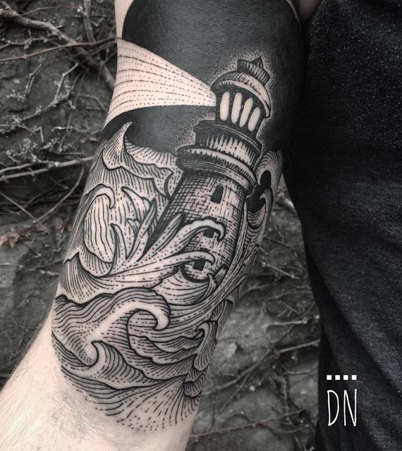 lighthouse tattoo on bicep