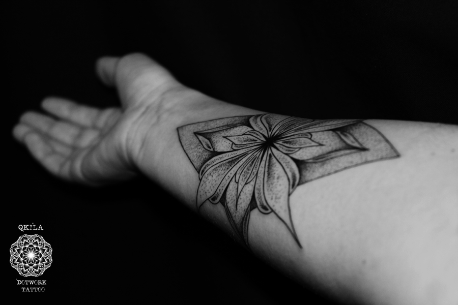 Dotwprk flower tattoo on arm