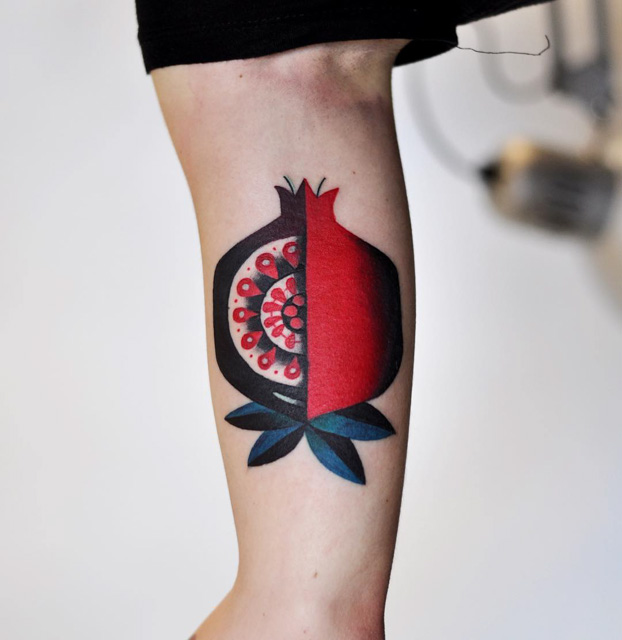quater cut tattoo pomegranate