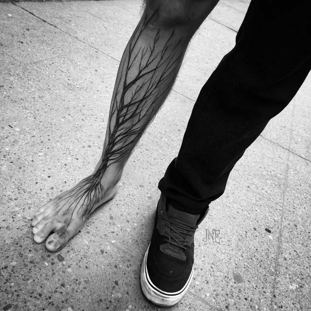 leg tree tattoo with roots