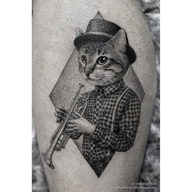 cat tattoo with trumpet