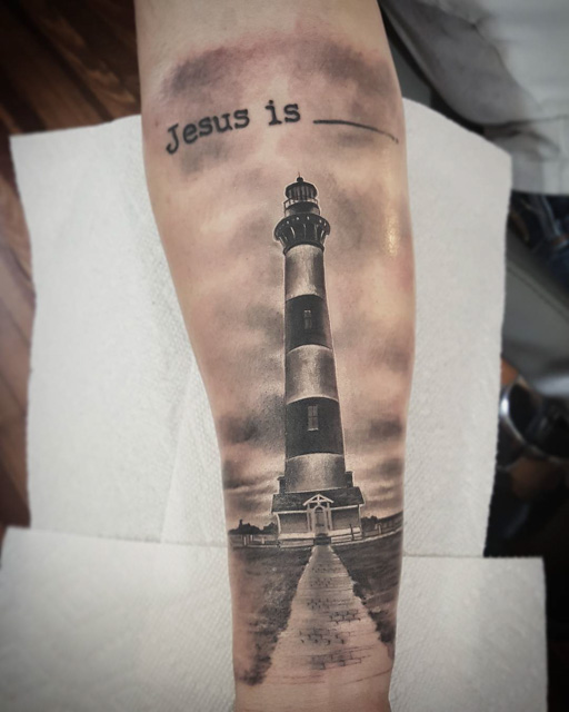 Religious light house tattoo