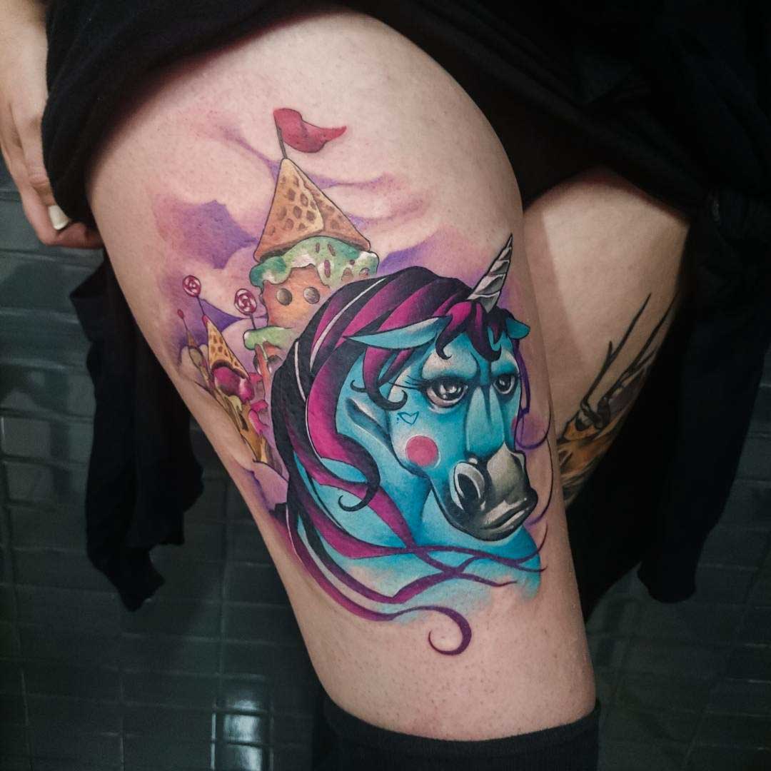 masculine unicorn tattoo on thigh