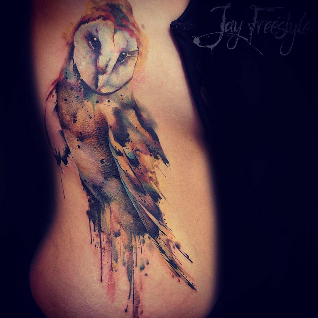 owl tattoo on torso side