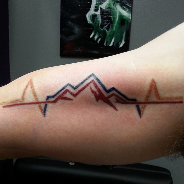 Cardio Mountains Tattoo on BIcep