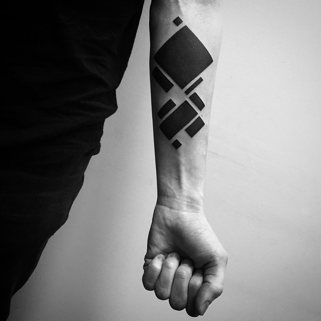 blackwork tattoo on forearm geometry
