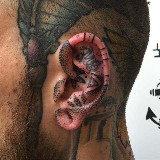 Tattoo in Ear by @ruthredtattoo