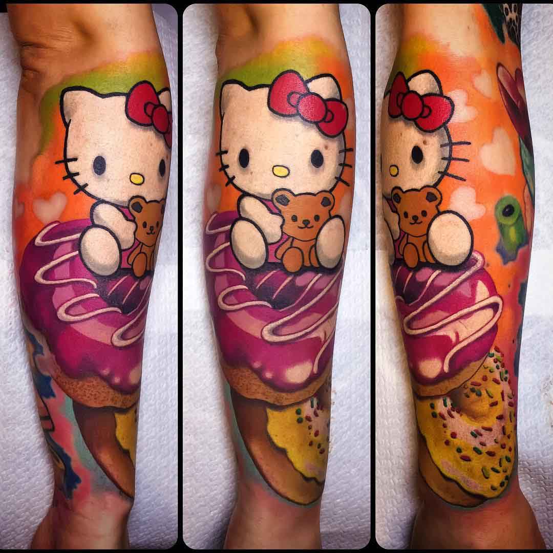 arm tattoo hello Kitty wit donuts
