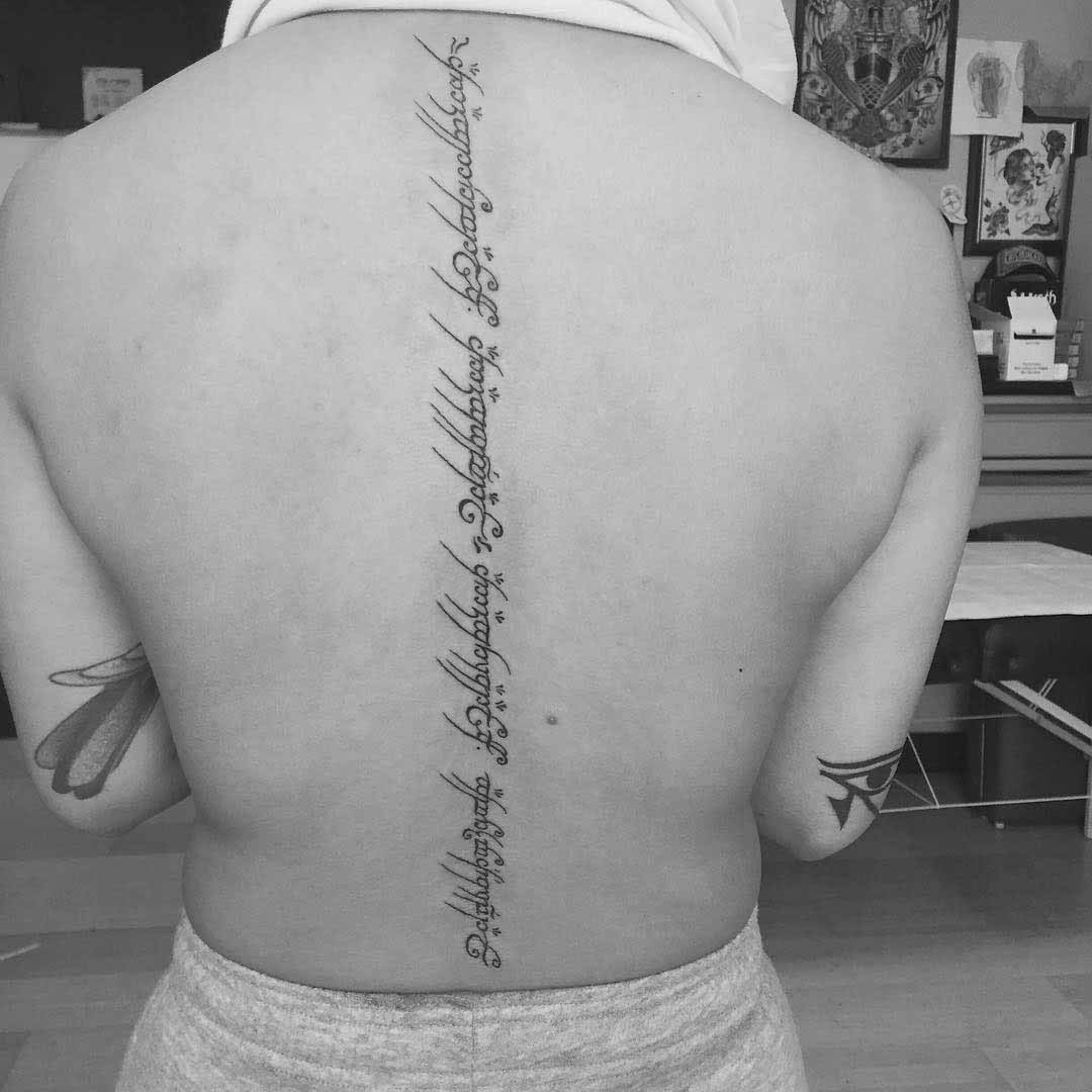 Tattoo on Spine by @mel_ortega_