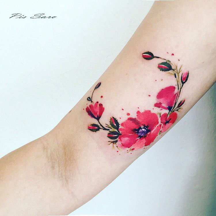 poppies bright tattoo on bicep