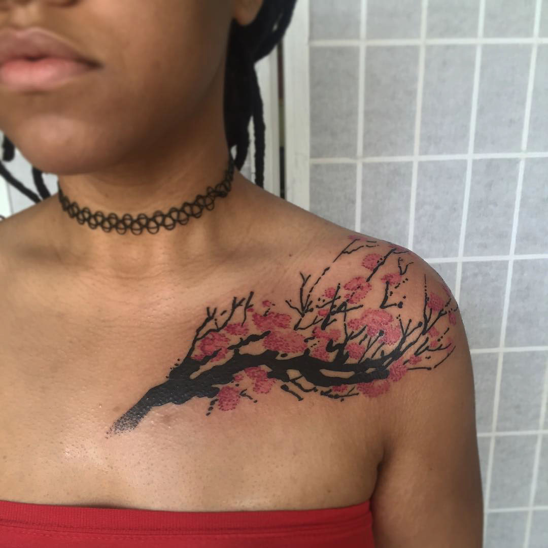 collar bone tattoo cherry blossom