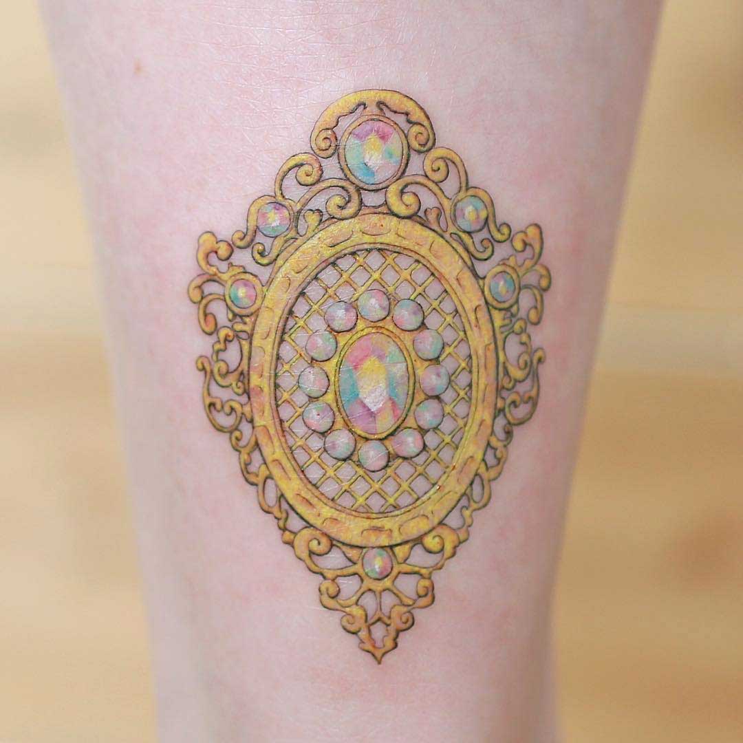 golden tattoo on ankle
