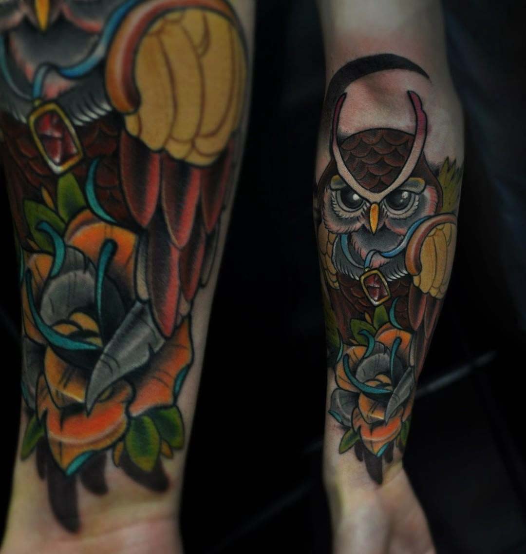 cool owl tattoo on forearm