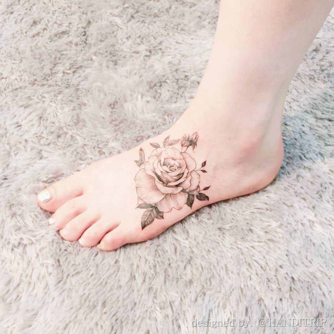 vintage rose tattoo on foot