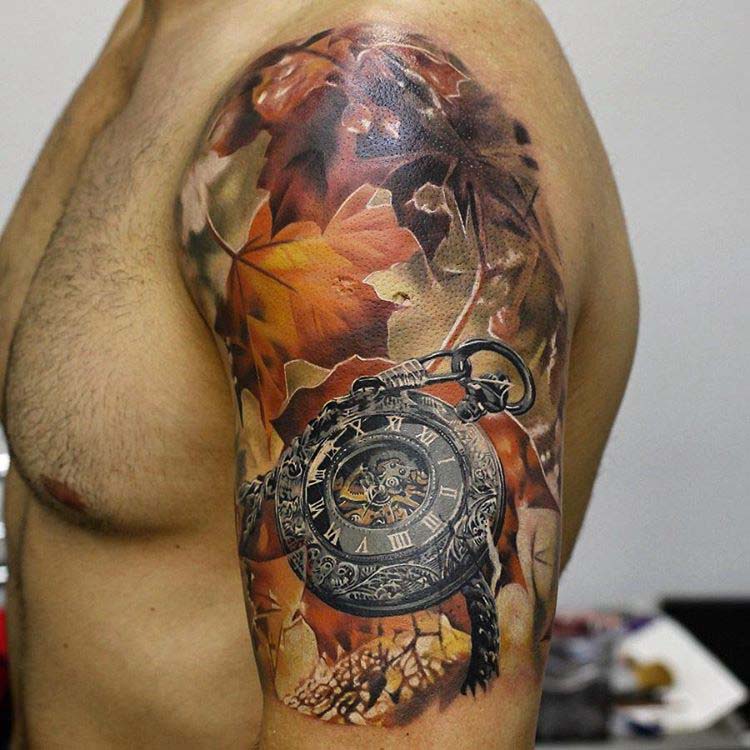 old clock and yellow leaves tattoo on shoulder