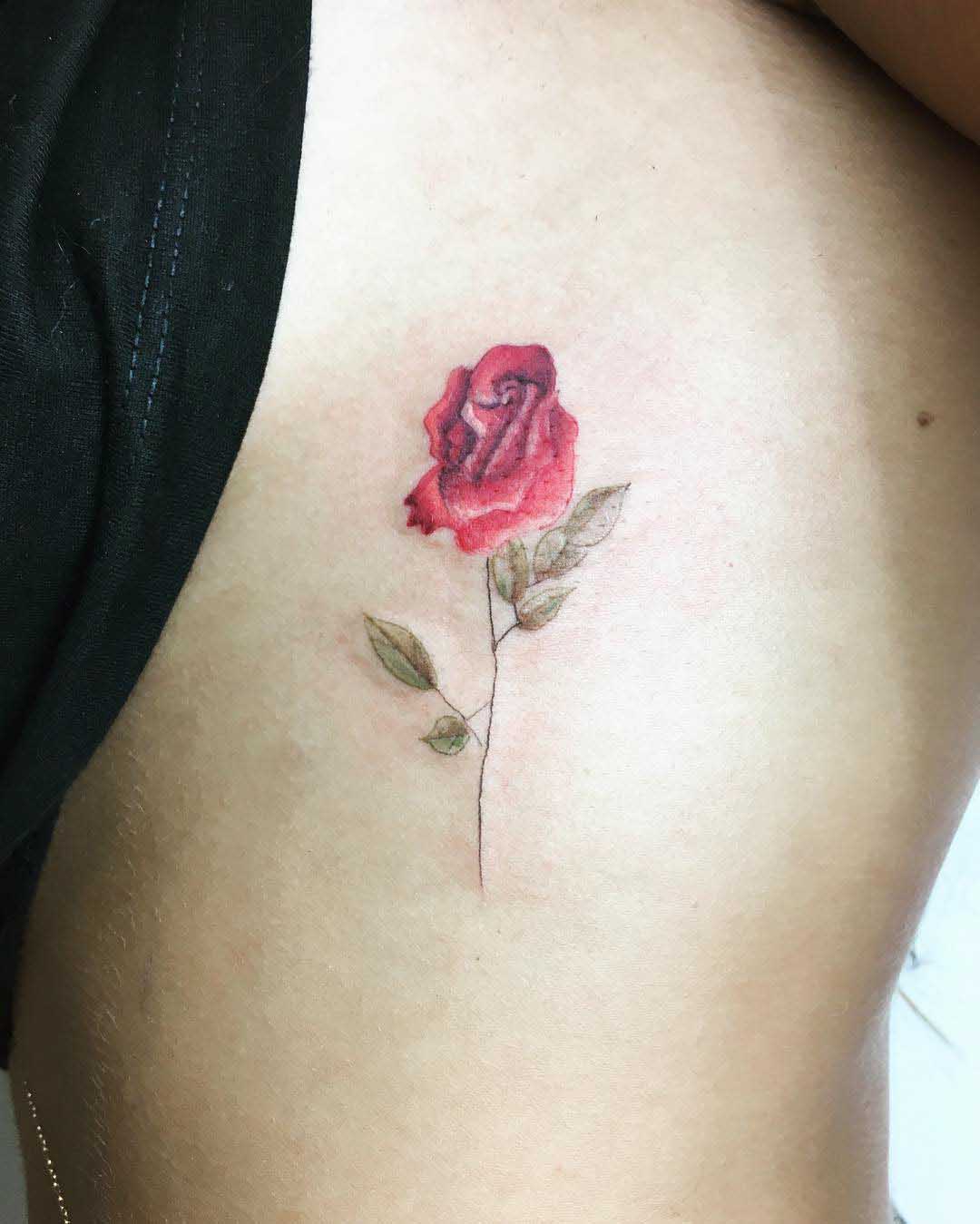 small red rose tattoo