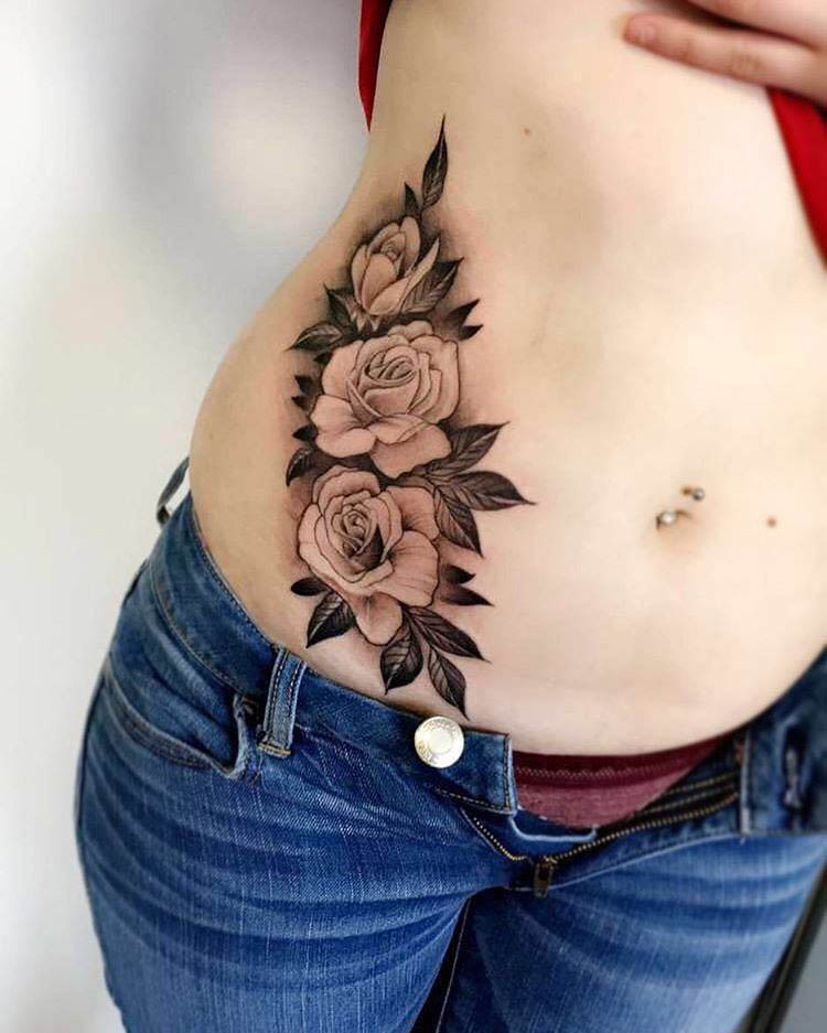 stomach side tattoo roses