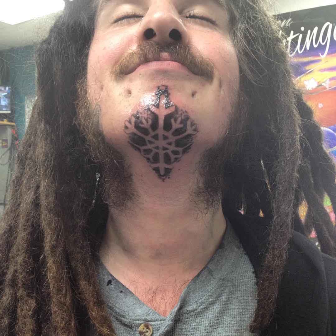Snowflake Tattoo Under Chin by holydreadlocksbatman