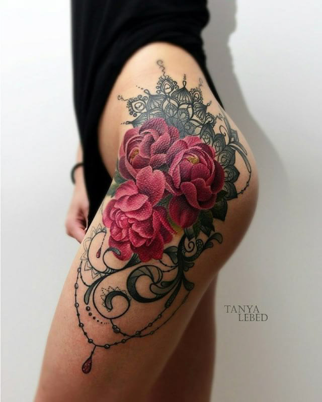 flowers tattoo on hip with baroque elements