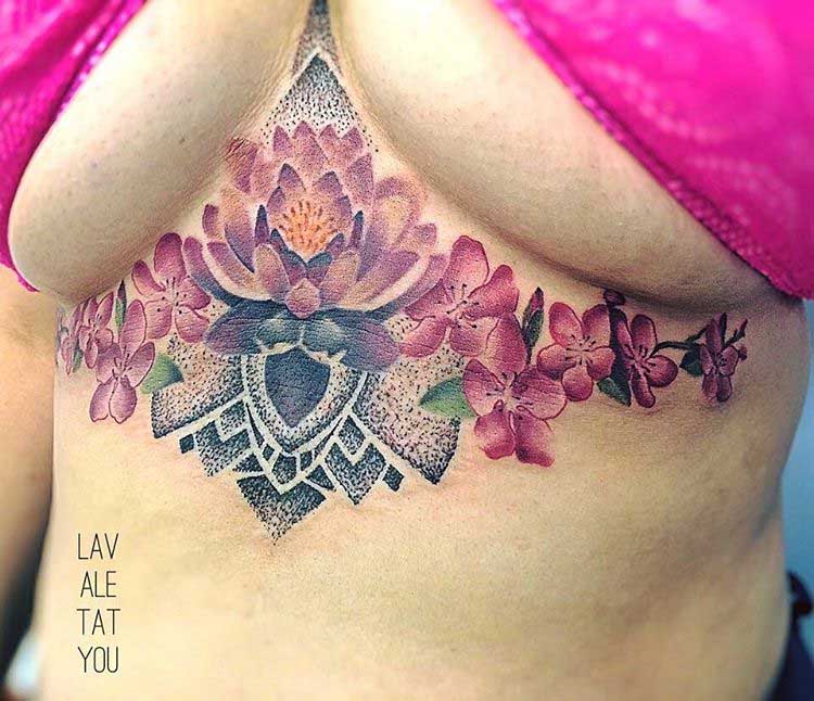 pink flowers and lotus tattoo under breast