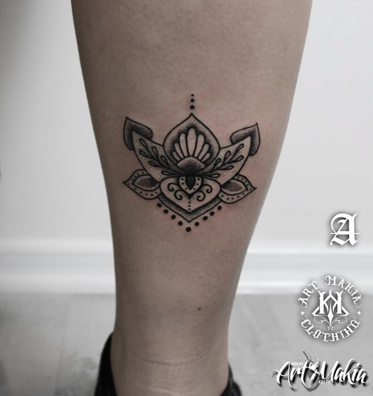 eastern themed lotus flower tattoo on leg