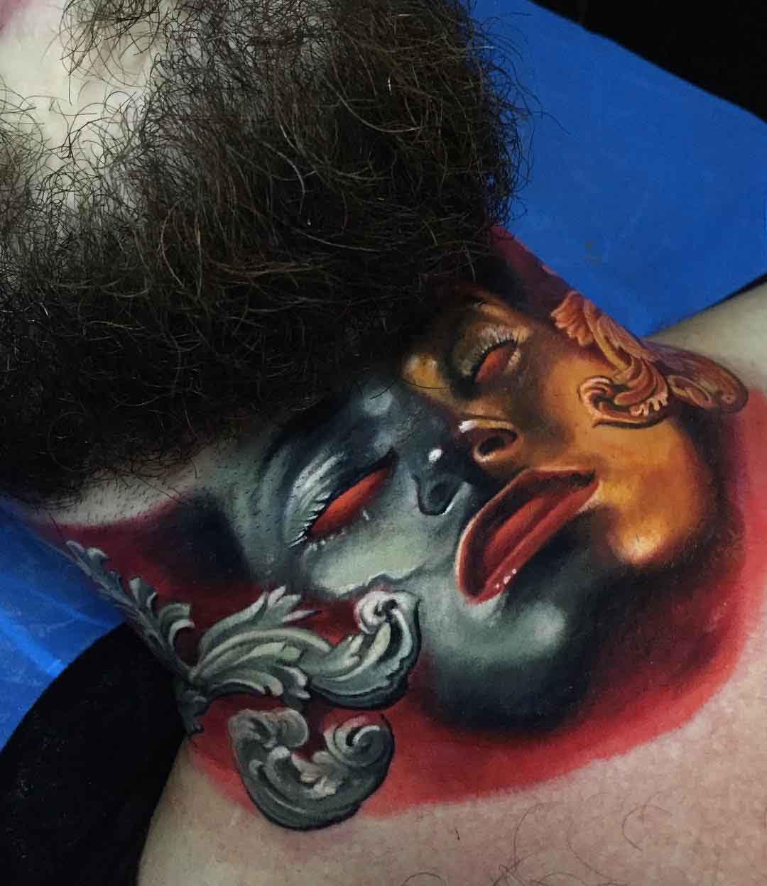 iron mask tattoo on neck