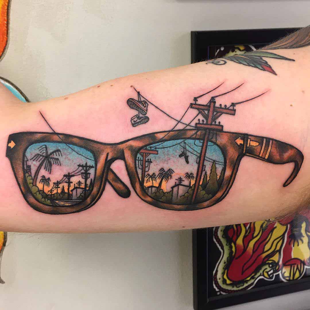 neo-traditional glasses tattoo on bicep