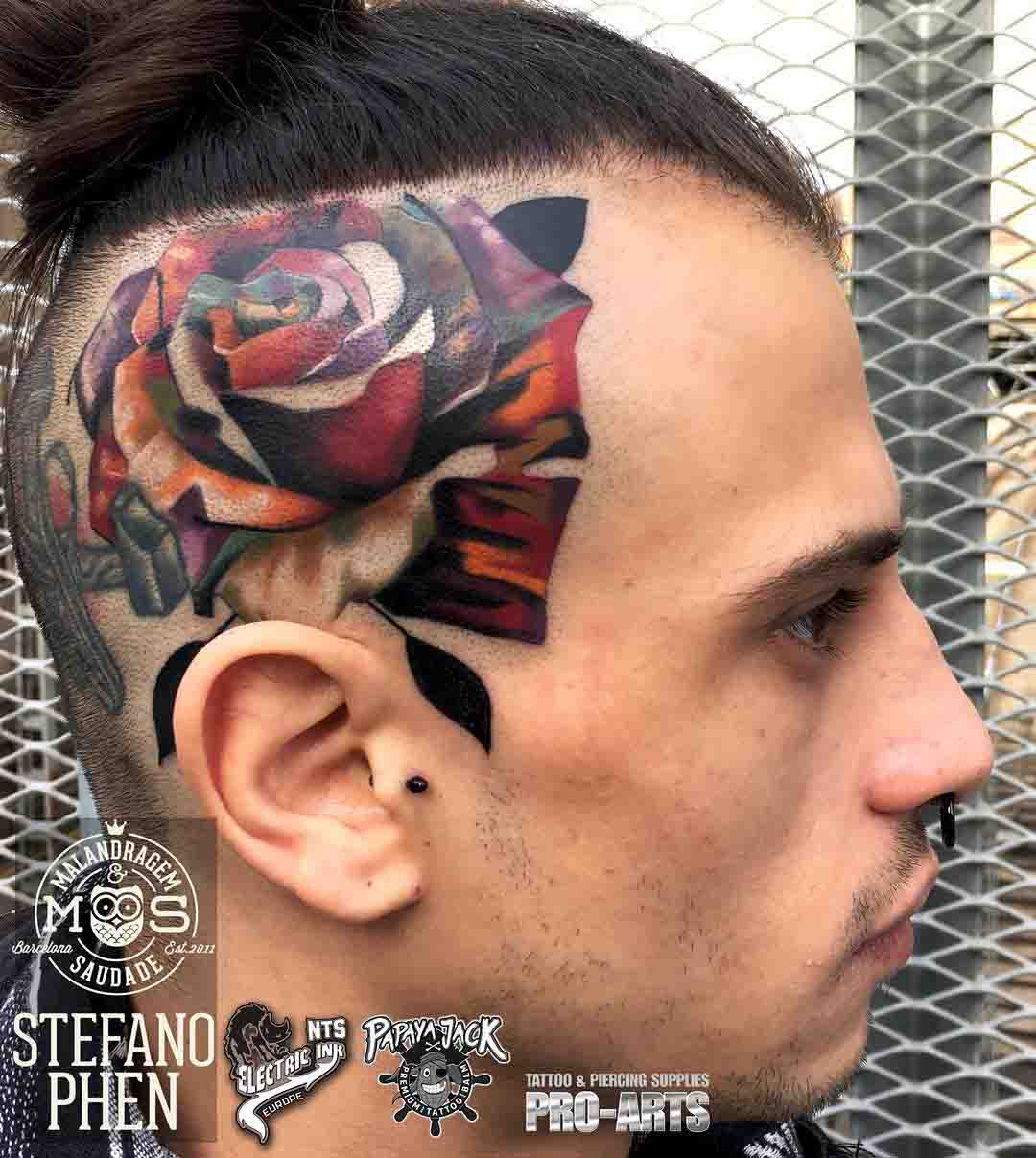 rose tattoo on the side of the head