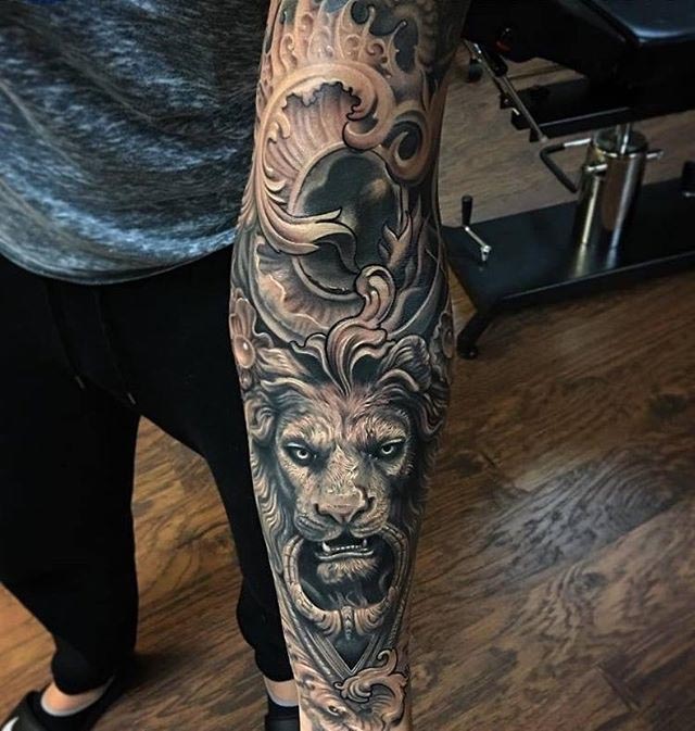 lion tattoo baroque on forearm