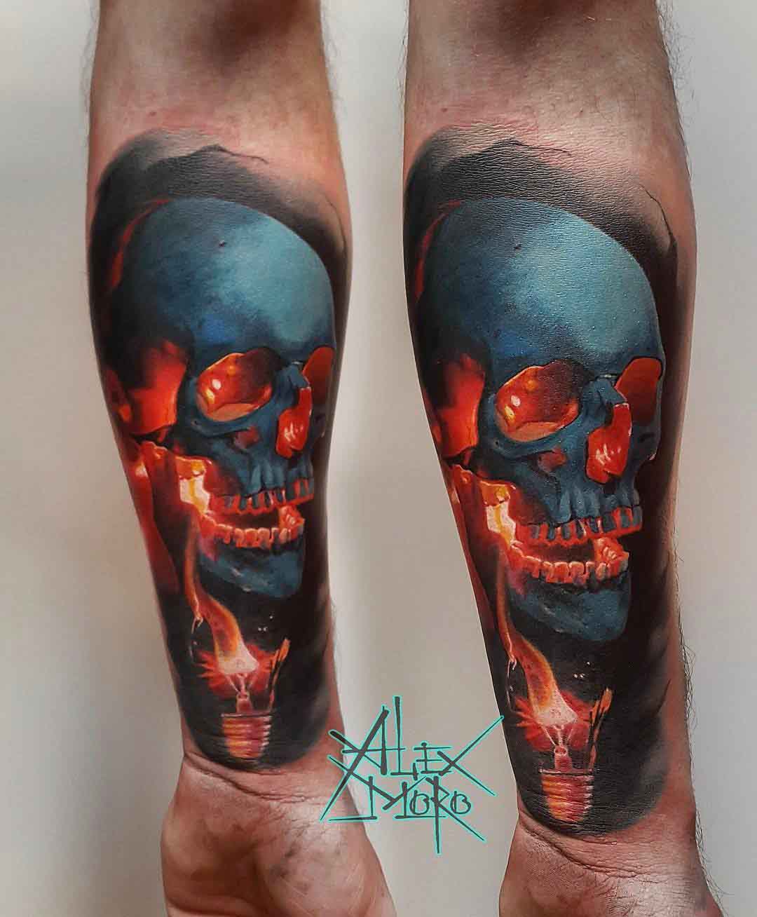 skull tatto on arm and lightbulb